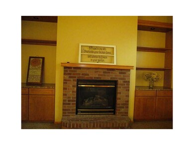 Fireplace. Built-in gas fireplace accented with cu