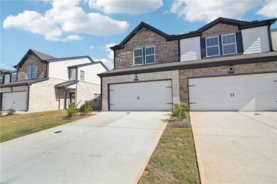 View of front facade featuring a garage