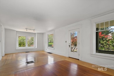 Foyer entrance featuring healthy amount of natural light and light wood-style floors