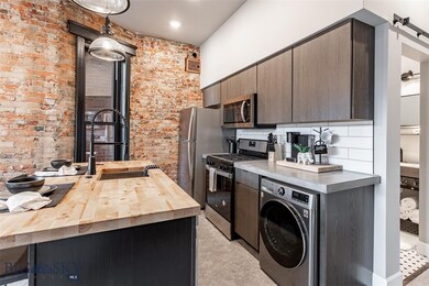 Kitchen with stainless steel appliances, wood coun
