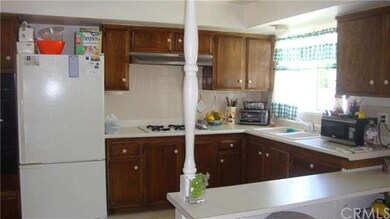 spacious kitchen with window above sink brings in 