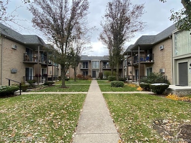 View of exterior entry featuring brick siding
