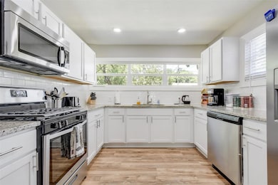 Kitchen featuring a sink, appliances with stainle