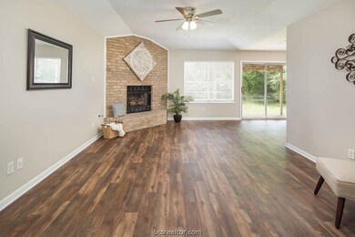 Living area anchored by gas log fireplace