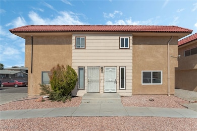 View of front of property with stucco siding and a