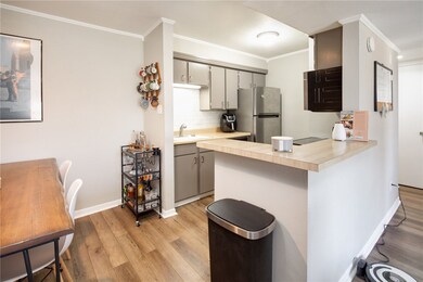 Kitchen featuring gray cabinetry, light countertop