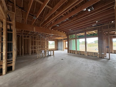 Misc room with unfinished concrete flooring