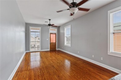 Living Room open to kitchen with tall vaultd ceili