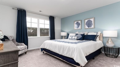 View of carpeted bedroom
