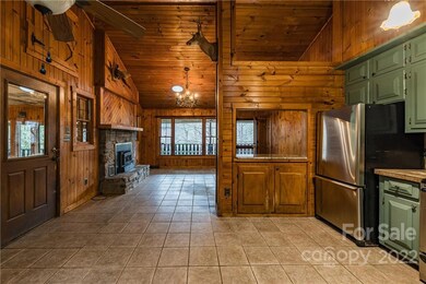 View of kitchen, entrance, and great room.