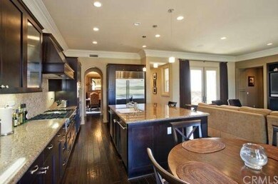 Through archway at far end of kitchen - you will f