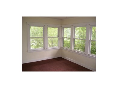 Bedroom two with lots of windows.