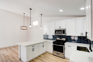 Kitchen with appliances with stainless steel finis