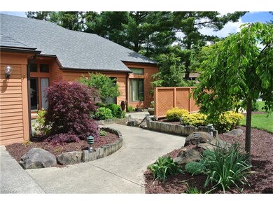 Beautifully landscaped front walk leads to Entry a