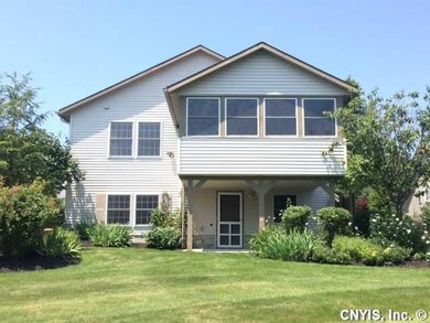 Exterior Back. The gardens have many perennials th