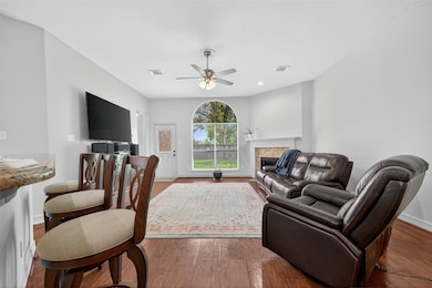 The family room is paired with hardwood flooring a