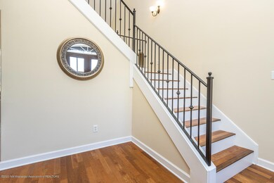 Large entry and wrought iron railing