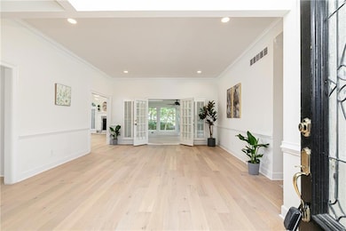 Foyer entrance featuring light wood finished floor