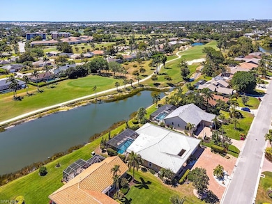 Birds eye view of property with a water view, view