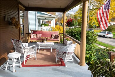 Spacious covered front porch with porch swing!