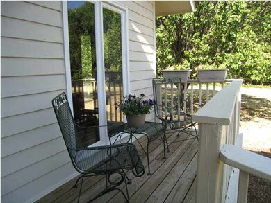 Charming front porch overlooking front yard facing