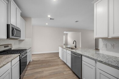This spacious kitchen is a chef's dream. It has gr