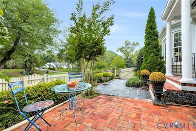 View of patio with a gate