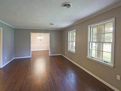 The living room opens to the family room and to th