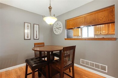 Open Dining room area with window to the kitchen s
