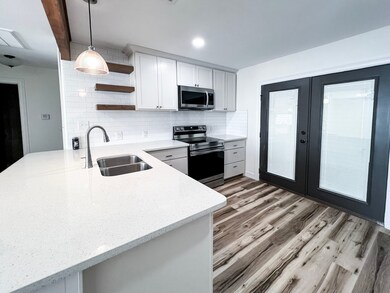 Discover a sleek kitchen with stainless steel appl