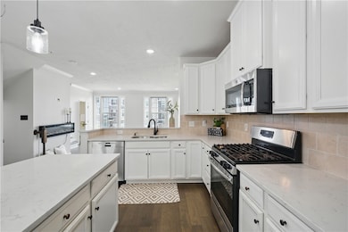 Kitchen is light and bright with its beautiful whi