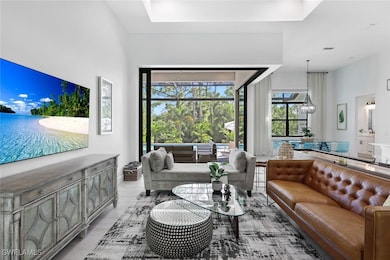 Living room with light hardwood / wood-style floor