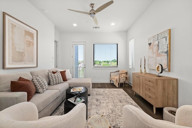 Living room with visible vents, baseboards, ceili