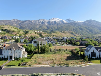 View of mountain backdrop featuring nearby suburban area