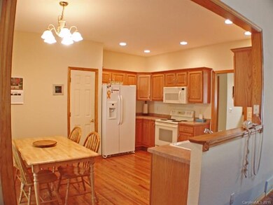 Kitchen with Hardwood Floors and open to Great Roo