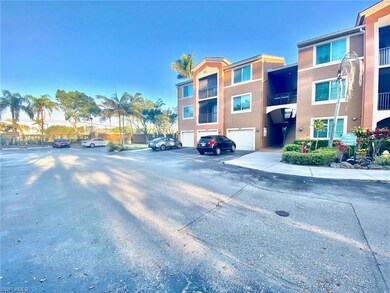 View of building exterior featuring uncovered parking