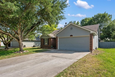 Ranch-style house featuring a garage, concrete dr
