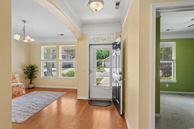 Entryway with ornamental molding and a wealth of n