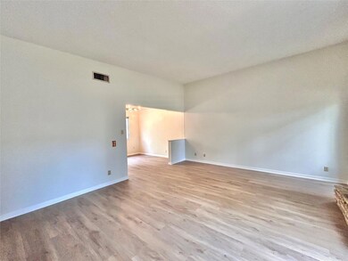 Spare room with light wood-style flooring, basebo