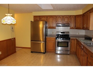 Updated eat in kitchen with stainless range & refr