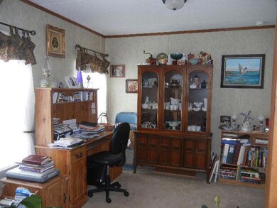 Don't be forced to take space away from guests by using a bedroom as an office.  This home provides a designated office / hobby room.