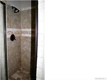 Tiled shower with oil rubbed bronze trim