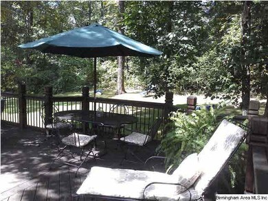 Deck overlooking beautiful back yard