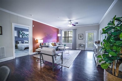 Living room with ceiling fan, dark hardwood / wood