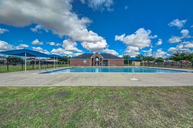 Neighborhood clubhouse with a sparkling pool, offe