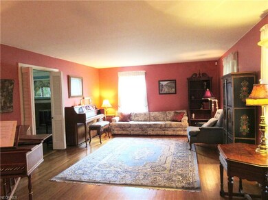 Living room with doors that lead into the family r