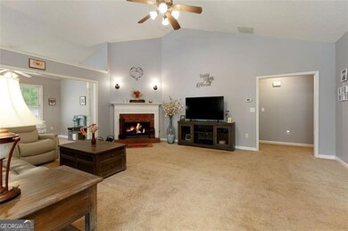 View to large Living Room; Vaulted ceiling; gas starter fire place