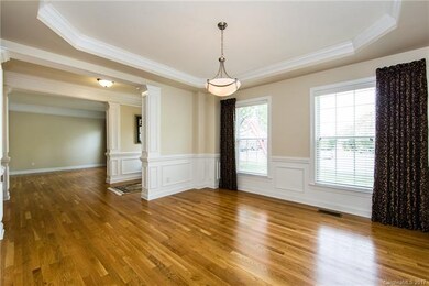 Dining room flows through foyer to formal living r
