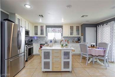 Kitchen featuring appliances with stainless steel