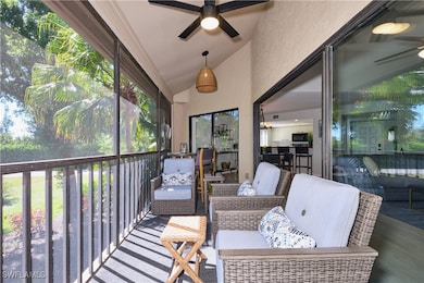 Sunroom featuring lofted ceiling and a lighted cei